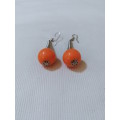 Eye catching, arty hanging orange bead earrings