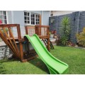 Wooden jungle gym with slide
