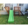 Wooden jungle gym with slide