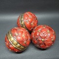 Three Highly Decorative Lacquered Wood Balls