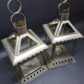 Two Large Pressed Metal Tee Lite Lanterns (Bid for Both)
