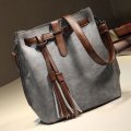 Fashion bucket ladies bag with tassels. Grey color. Stock in ZA.