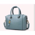 Fashion barrel style ladies handbag. Blue color. Stock in ZA