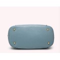 Fashion barrel style ladies handbag. Blue color. Stock in ZA