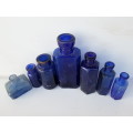 Antique blue glass bottles.