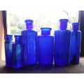 Six antique Cobalt blue bottles