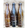 Three South African beer bottles