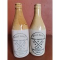 Two Krugersdorp ginger beer bottles.