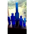 Five antique blue bottltes