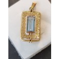 `ELECTRICK BLUE TOPAZ`  Set in a 9CT Yellow Gold Pendant (Genuine Gold)