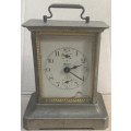 An unusual brass alarm clock with a musical movement....all not working