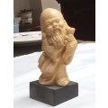 Hand Carved Oriental `Man with fish` signed approximately 10 cms tall