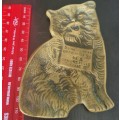 A lovely vintage brass flat cat ashtray with and embellished sign `Some people drop their H`s others