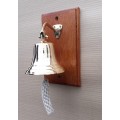 Solid brass ship, motivational bell 14cm diameter, sales bell. Wall mounted on solid wood.