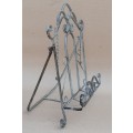 Wrought metal book stand.