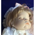 Sleeping Baby Porcelain Doll on Heart Shaped Pillow