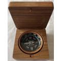 COPPER COMPASS IN BROWN WOODEN BOX.
