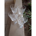 A SET OF FOUR SMALLER SIZE CRYSTAL WINE GLASSES WITH DIAMOND FLASH