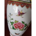 HANDPAINTED CHINESE PORCELAIN VASE, FILLED WITH CONTENTS STILL INSIDE.