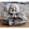 Carved clay buddha laughing happy figurine