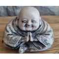 Carved clay buddha laughing happy figurine