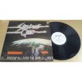 STATUS QUO  Rockin` All Over The World Rhodesian LP VINYL RECORD [Shelf G]