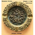 A very ornate, extremely heavy brass ashtray for it`s size. Diameter  17.5mm. Weight  +-1.1kg