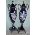 Pair of Porcelain Pedestal Lidded Urns Cobalt Blue Foral Hand Painted Cherub finial