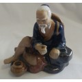 Classic Chinese the Potter blue seated Mud man figurine