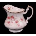 A Paragon Bone China Victoriana Rose pattern milk jug