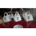 Beautiful Miniature Teaset duo's on kettle shaped stand
