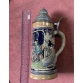 Vintage German ceramic beer mug with a hinged pewter lid.