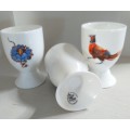 THREE HANDPAINTED EGG-CUPS BY JANE ABBOTT