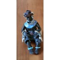Original unique ceramic figurine. Xhosa Youth by Elizabeth Rowland. With detailed description.