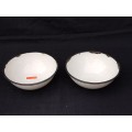 Two white enamel bowls
