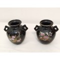 Two black vases