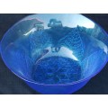 Large blue salad bowl decorated with leaves