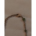 Gold tone Necklace with green stones