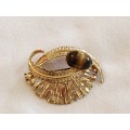 Tigers eye and gold tone brooch