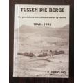 Tussen Die Berge Die geskiedenis van `n landstreek en sy mense 1848 - 1998 . E.Greyling  Ltd 80/150