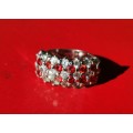 BEAUTIFUL SILVER RING WITH RED STONES. WEIGHT: 7.50 GRAMS. STAMPED 925. AS NEW!