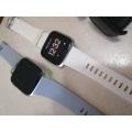 2 X FITBIT SMART WATCHES, ONE POWERS ON,OTHER BLANK, ONE BID FOR BOTH