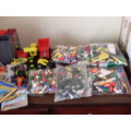 A LARGE COLLECTION OF LEGO PIECES AND BOOKLETS ETC