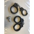 Pretend playing plastic hand cuffs - police playing x 2