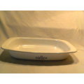 A first edition "CORNING WARE" roasting pan made in USA. Needs TLC. In good secondhand condition.