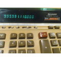 A 1960's Sharp Ribbon print Electronic Calculator. In good working Order, it needs a fresh ribbon.