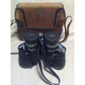 A Old " Tasco " binocular set In a case 7X-15 325Ft @ 1000yrd's With Strap & Needs a little TLC.
