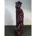 A Old Vintage Asian Oriental hand carved wood Figurine. Ideal for display. In second hand condition.