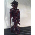 A Old Vintage Asian Oriental hand carved wood Figurine. Ideal for display. In second hand condition.