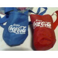 A Coca Cola Job Lot of Accessories in a cool bag.2 Ice Trays,2 Can Coolers,Carriers & a Can Hanger.